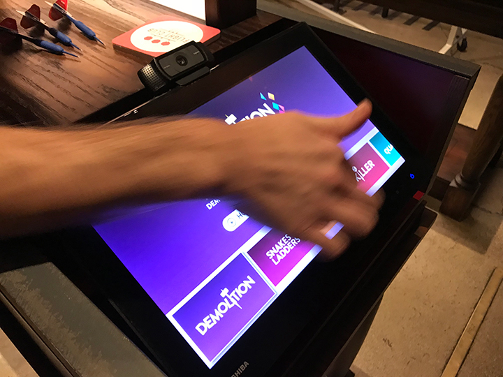 Playing Steel Tip Darts at Flight Club Chicago. A close-up of the digital kiosk that serves as the hub of the oche area, and another key ingredient to social darts.